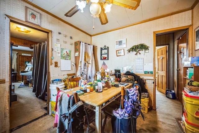 dining area featuring wallpapered walls, crown molding, carpet, and a ceiling fan