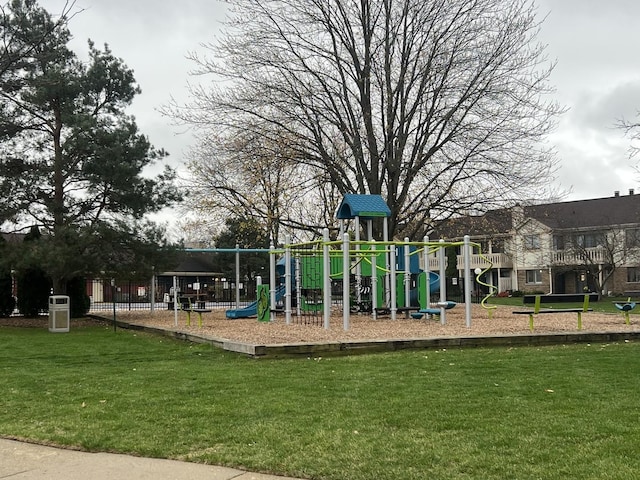 community play area featuring a lawn