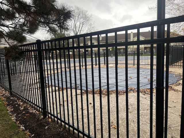 view of gate with fence