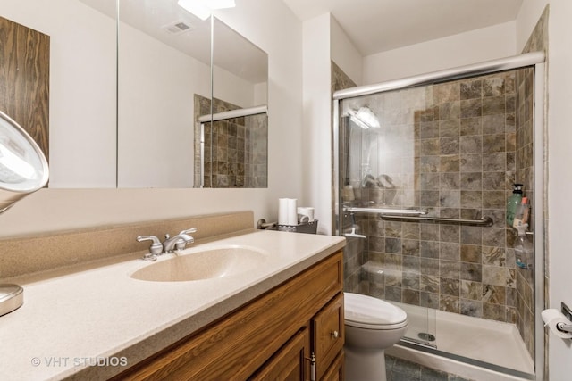 full bathroom with visible vents, vanity, toilet, and a shower stall