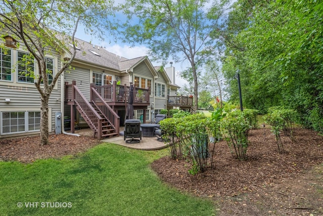 rear view of property featuring cooling unit, stairs, a deck, a patio area, and a lawn