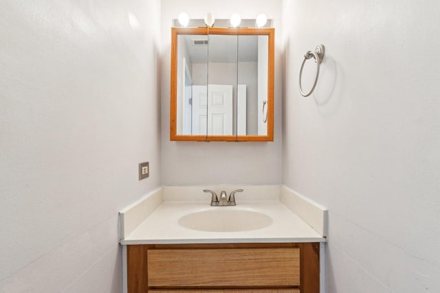 bathroom with visible vents and vanity