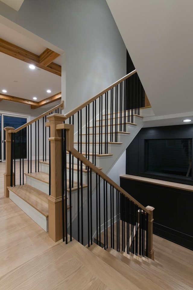 stairway featuring recessed lighting and wood finished floors