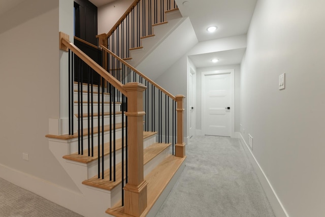 staircase with visible vents, recessed lighting, baseboards, and carpet