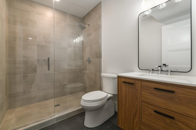 full bath with vanity, toilet, a stall shower, and tile patterned flooring