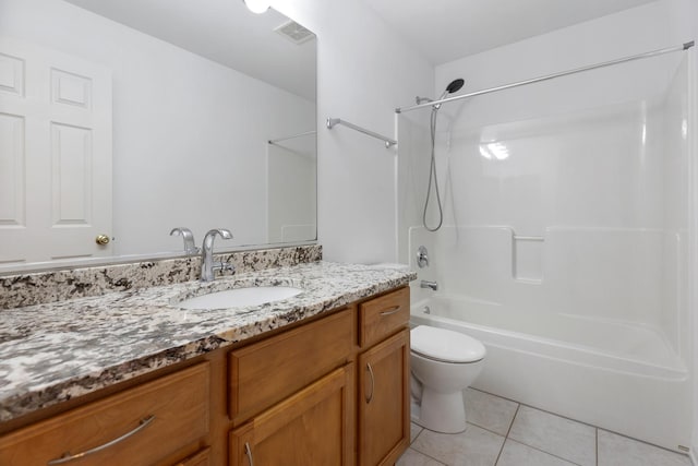 bathroom with vanity, washtub / shower combination, visible vents, tile patterned flooring, and toilet