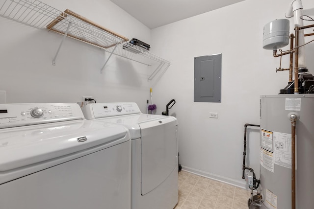 clothes washing area with electric panel, gas water heater, separate washer and dryer, baseboards, and laundry area