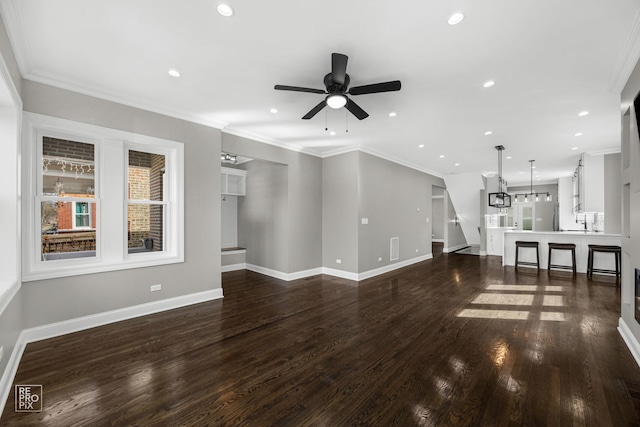 unfurnished living room featuring recessed lighting, dark wood-style floors, a ceiling fan, and crown molding