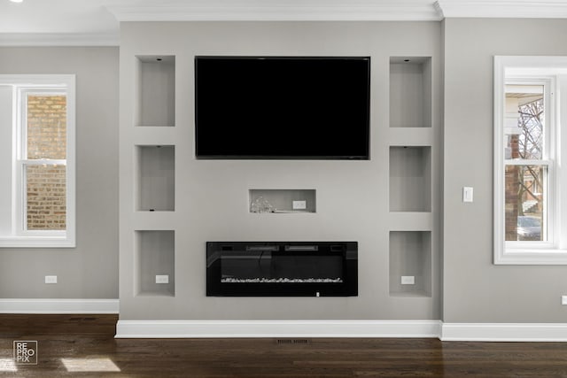 unfurnished living room with crown molding, dark wood-style floors, and baseboards