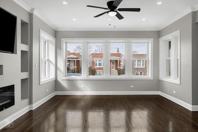 unfurnished living room with wood finished floors, baseboards, recessed lighting, ceiling fan, and crown molding