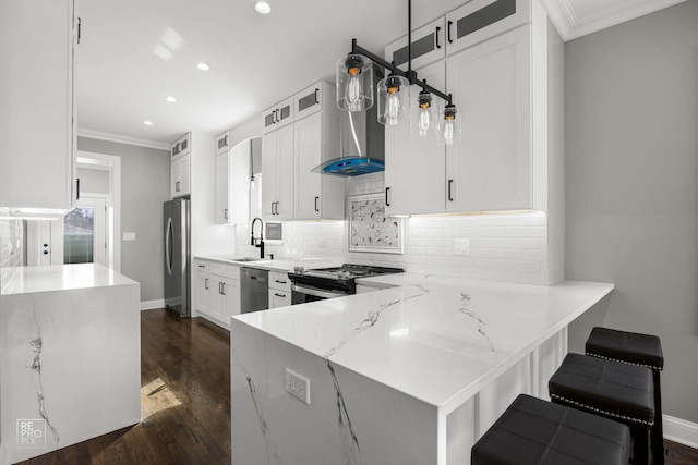 kitchen featuring ornamental molding, appliances with stainless steel finishes, light stone countertops, and a sink