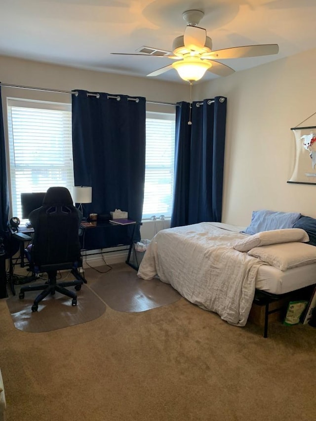 bedroom with visible vents, ceiling fan, and carpet