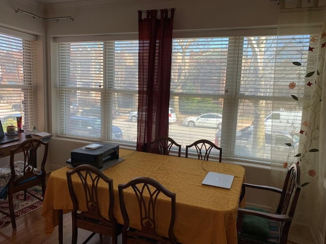 dining area with wood finished floors