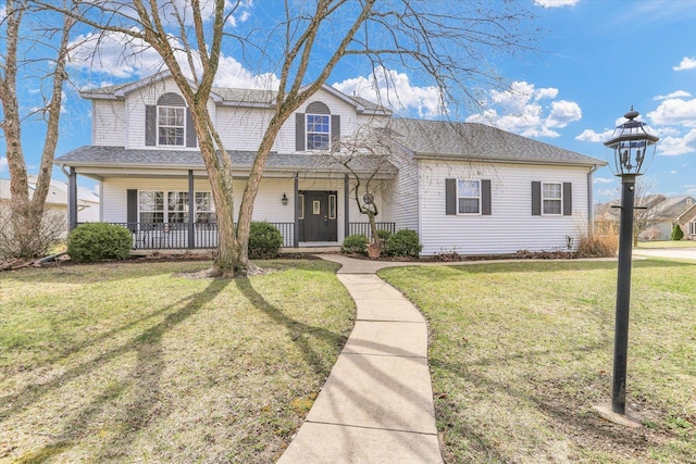 3402 Mill Creek Ct, Champaign, IL 61822 - view of front of home with a shingled roof, a porch, and a front yard