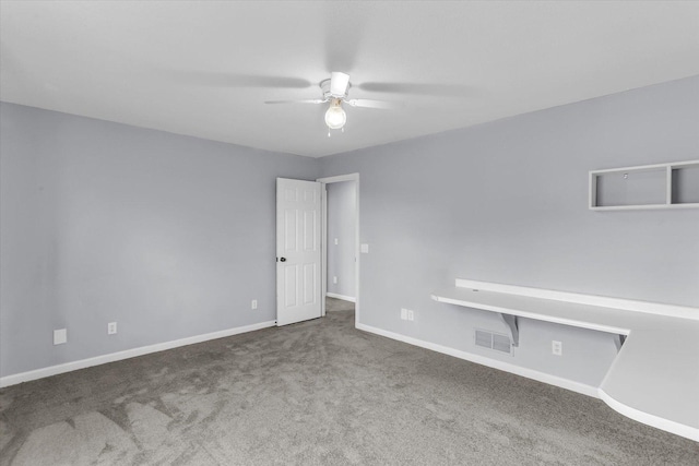 3402 Mill Creek Ct, Champaign, IL 61822 - spare room with baseboards, a ceiling fan, carpet flooring, and visible vents
