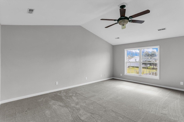 3402 Mill Creek Ct, Champaign, IL 61822 - carpeted empty room featuring a ceiling fan, baseboards, visible vents, and vaulted ceiling