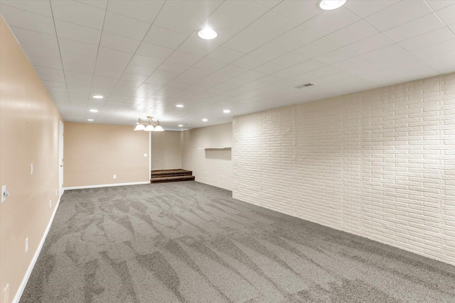 3402 Mill Creek Ct, Champaign, IL 61822 - finished below grade area with carpet floors, baseboards, recessed lighting, and brick wall