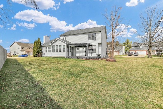 3402 Mill Creek Ct, Champaign, IL 61822 - back of property with a lawn, a pergola, a chimney, and a deck