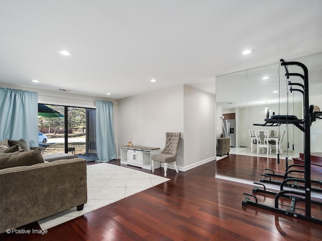 living room featuring visible vents, recessed lighting, wood finished floors, and baseboards