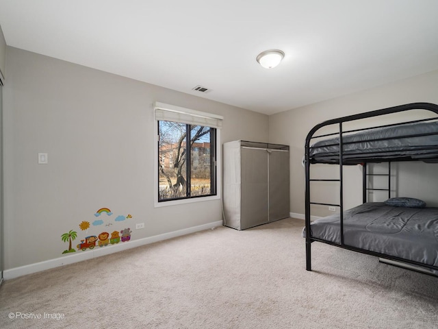 unfurnished bedroom with visible vents, baseboards, and carpet