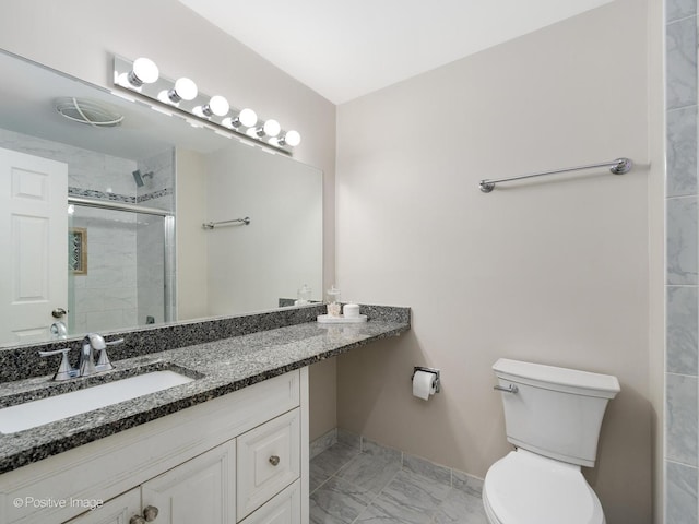 bathroom with toilet, marble finish floor, a shower stall, baseboards, and vanity