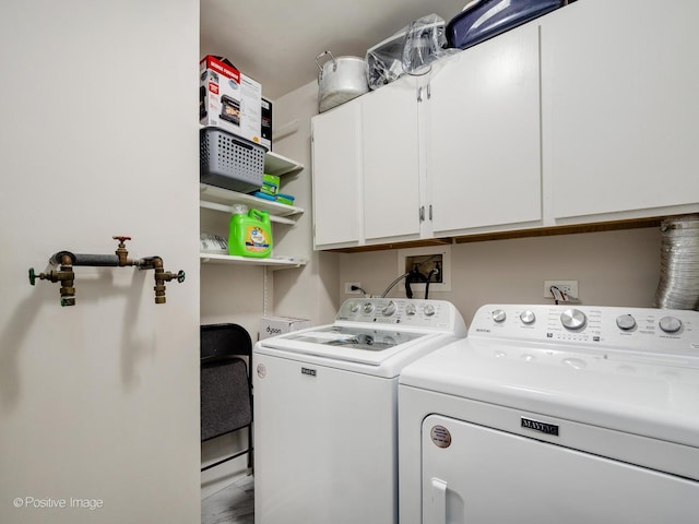 laundry room featuring cabinet space and independent washer and dryer