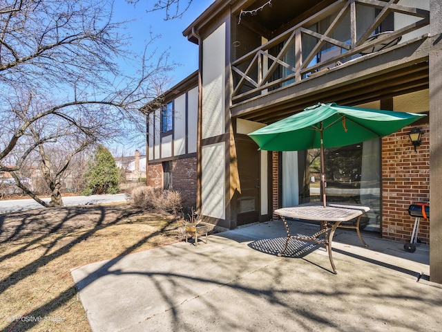 view of patio with a balcony