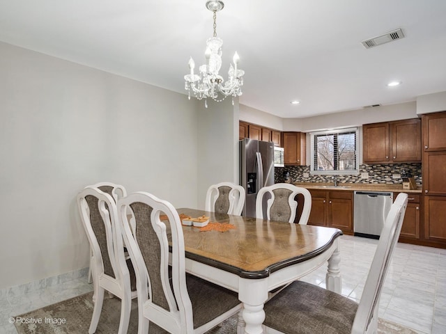 dining room with recessed lighting, visible vents, and a chandelier