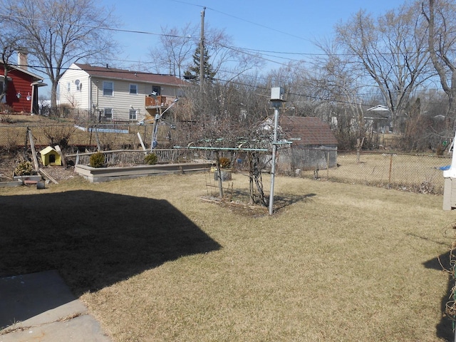 view of yard featuring a garden and fence