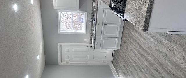 foyer entrance featuring a textured wall