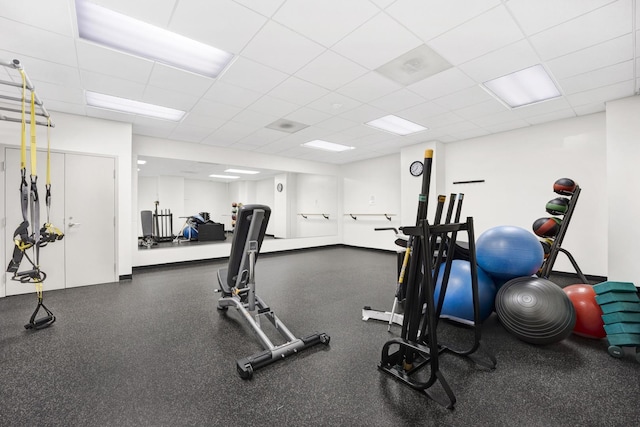 workout area featuring a paneled ceiling