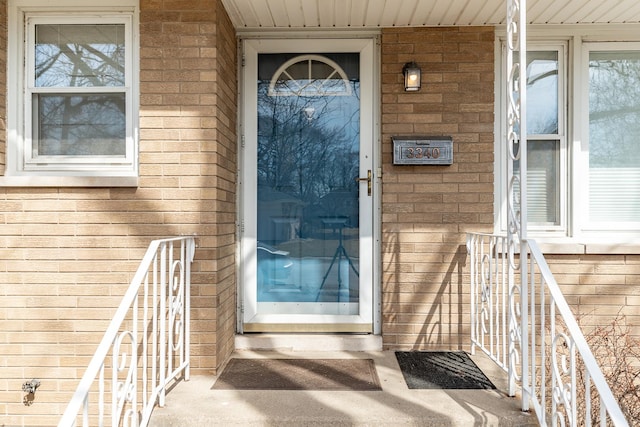 entrance to property with brick siding