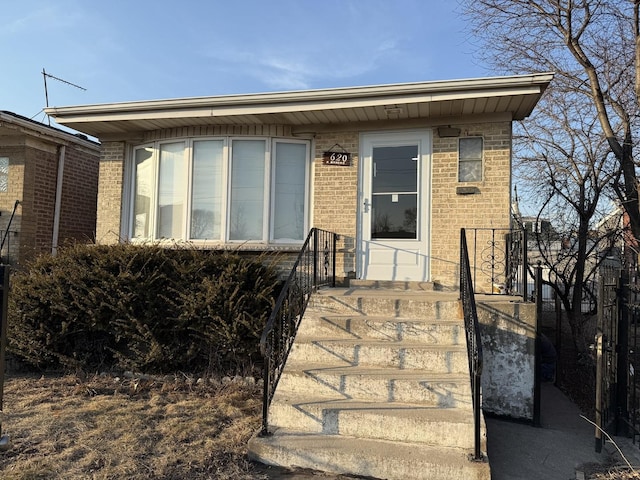 view of front facade featuring brick siding