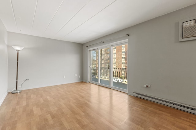 unfurnished living room featuring light wood finished floors, baseboards, and a baseboard radiator