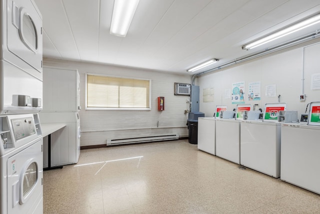 shared laundry area with a wall mounted air conditioner, electric panel, a baseboard heating unit, washing machine and dryer, and stacked washer / dryer