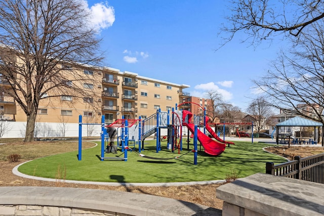 communal playground featuring a gazebo and a lawn