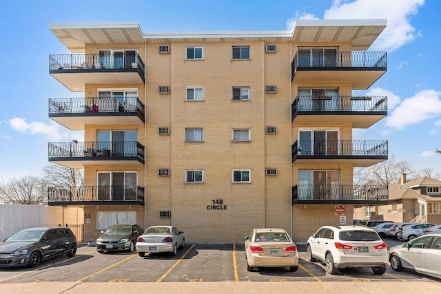 view of property with uncovered parking