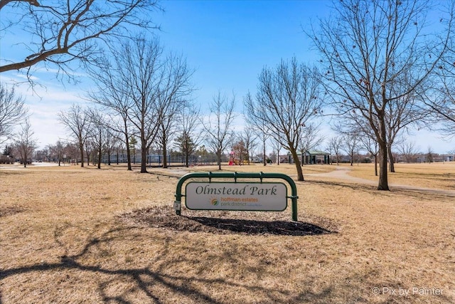 view of property's community with a lawn