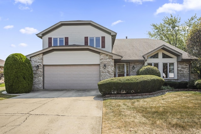 view of front facade featuring a garage, brick siding, concrete driveway, and a front lawn