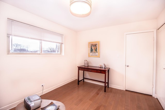 interior space with hardwood / wood-style flooring and baseboards