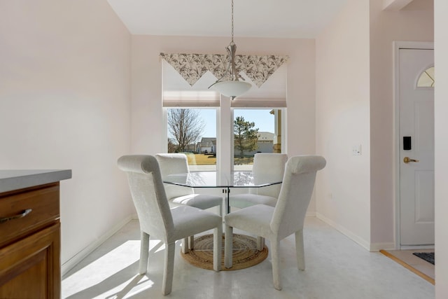 dining room featuring baseboards