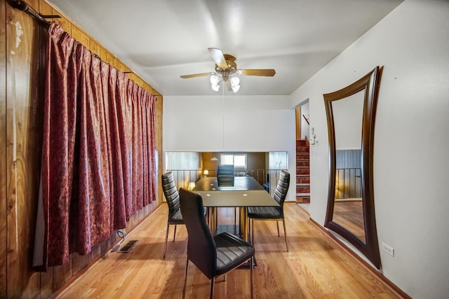 dining area with visible vents, light wood-type flooring, and ceiling fan