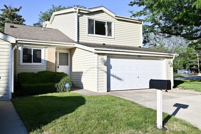 view of front of home with a garage, concrete driveway, and a front yard