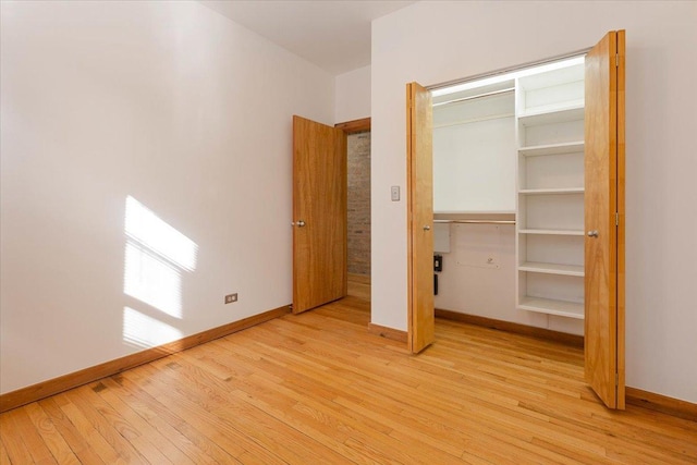 1637 W Pratt Blvd Unit 2W, Chicago, IL 60626 - unfurnished bedroom featuring light wood-type flooring and a closet