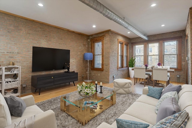 1637 W Pratt Blvd Unit 2W, Chicago, IL 60626 - living area featuring wood finished floors, brick wall, and recessed lighting