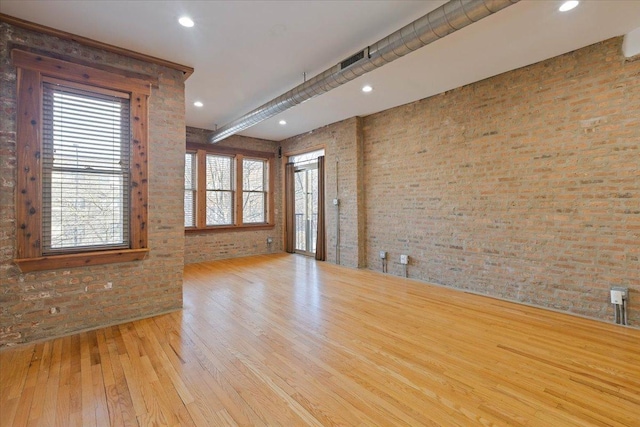 1637 W Pratt Blvd Unit 2W, Chicago, IL 60626 - spare room featuring hardwood / wood-style flooring, brick wall, and recessed lighting