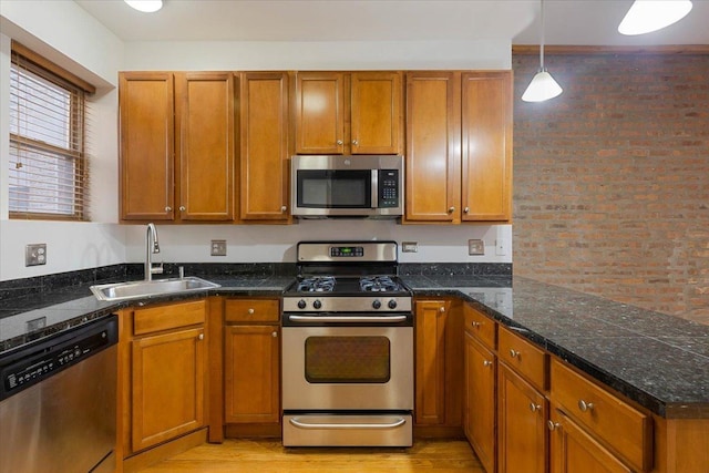 1637 W Pratt Blvd Unit 2W, Chicago, IL 60626 - kitchen with appliances with stainless steel finishes, brown cabinetry, and brick wall