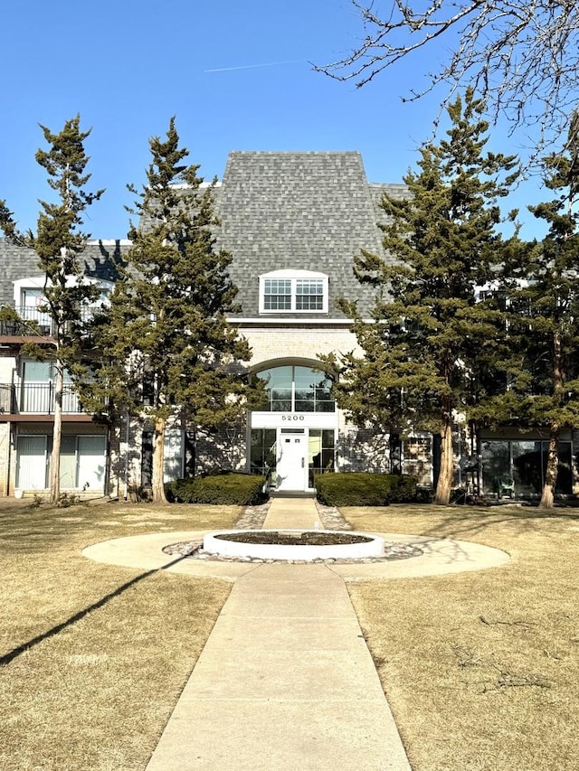 view of front of home featuring a shingled roof