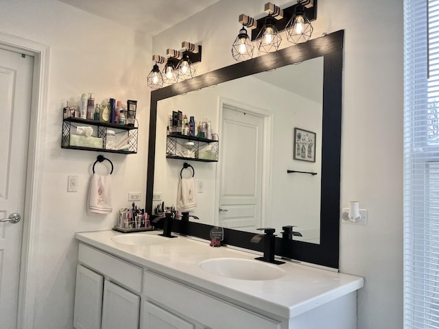 full bathroom featuring double vanity and a sink