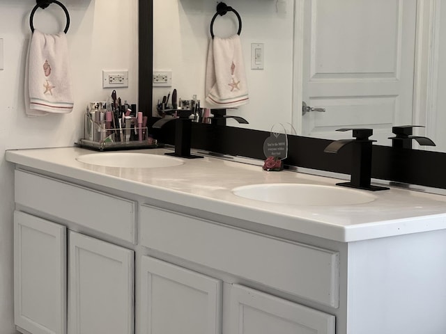 bathroom featuring double vanity and a sink